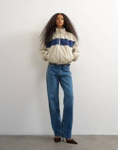 Model wearing Contrast piping track jacket in cream