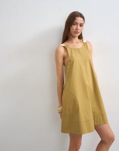 Model wearing Contrast stitch tape detail smock mini dress in light khaki