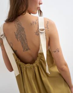 Model wearing Contrast stitch tape detail smock mini dress in light khaki