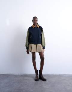 Model wearing Contrast suede varsity bomber jacket in multi