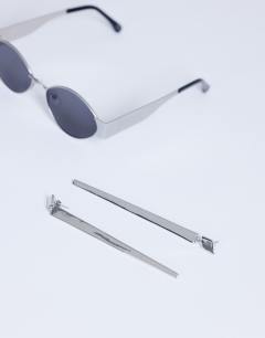 Model wearing Cora asymmetric drop stud earring in silver tone