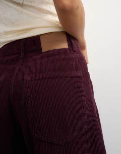 Model wearing Cord Barrel mid rise in aubergine