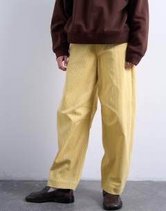 Model wearing Cord high rise barrel trouser in buttermilk