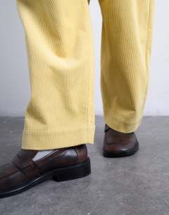 Model wearing Cord high rise barrel trouser in buttermilk