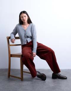 Model wearing Cord high rise barrel trouser in rust