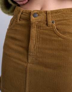 Model wearing Cord mini pelmet skirt in honey