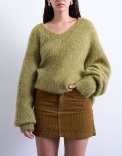 Model wearing Cord mini pelmet skirt in honey