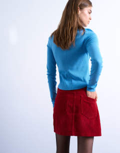 Model wearing Cord mini pelmet skirt in red