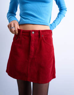 Model wearing Cord mini pelmet skirt in red