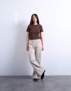 Model wearing Cord pull on jogger in stone