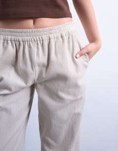 Model wearing Cord pull on jogger in stone