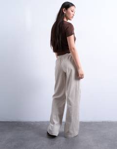 Model wearing Cord pull on jogger in stone