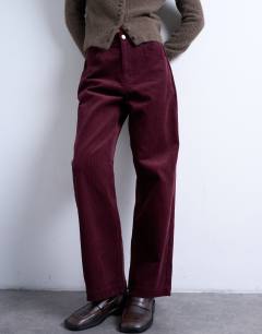 Model wearing Cord slouchy low slung trouser in burgundy
