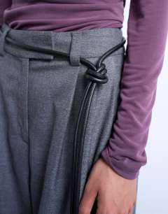 Model wearing Cord style belt in black