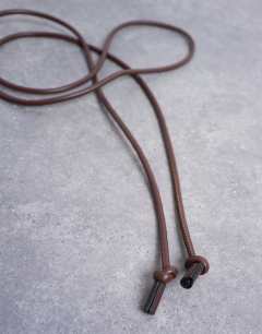 Model wearing Cord style belt in chocolate