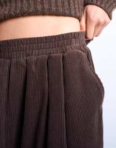 Model wearing Cord wide leg awkward length trouser in brown