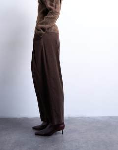 Model wearing Cord wide leg awkward length trouser in brown