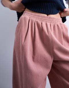 Model wearing Cord wide leg awkward length trouser in pink