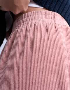 Model wearing Cord wide leg awkward length trouser in pink
