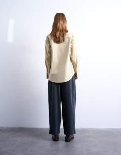Model wearing Cord wide leg awkward length trouser in slate