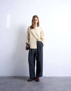 Model wearing Cord wide leg awkward length trouser in slate