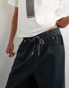 Model wearing Cord wide leg pull on trouser in grey