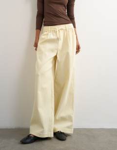 Model wearing Cord wide leg pull on trouser in stone