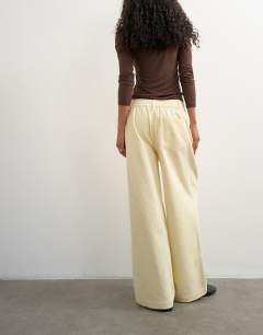 Model wearing Cord wide leg pull on trouser in stone