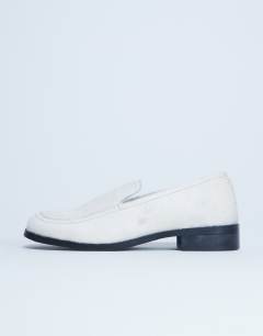 Model wearing Corrie flat shoe loafer in off white hair on real leather