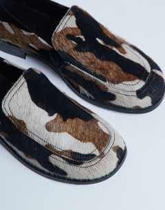 Model wearing Corrie pony real leather flat shoe loafer in animal print