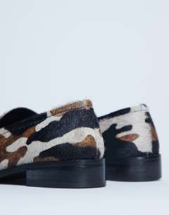 Model wearing Corrie pony real leather flat shoe loafer in animal print