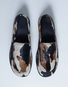 Model wearing Corrie pony real leather flat shoe loafer in animal print