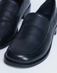 Model wearing Corrie real leather flat shoe loafer in black