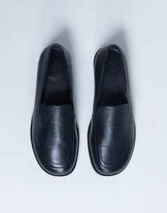 Model wearing Corrie real leather flat shoe loafer in black