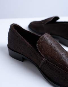Model wearing Corrie real leather pony flat shoe loafer in chocolate