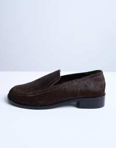 Model wearing Corrie real leather pony flat shoe loafer in chocolate