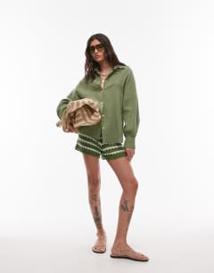 Model wearing Cotton casual angled armhole shirt in khaki