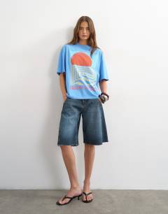 Model wearing Topshop 'Coucher De Soleil' graphic oversized tee in light blue