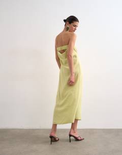 Model wearing Cowl back bandeau midi dress in cupro lime
