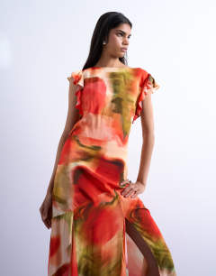 Model wearing Cowl back flutter sleeve maxi dress in abstract floral