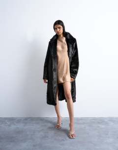 Model wearing Cowl back long sleeve mini satin in caramel