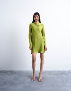 Model wearing Cowl back long sleeve mini satin in green