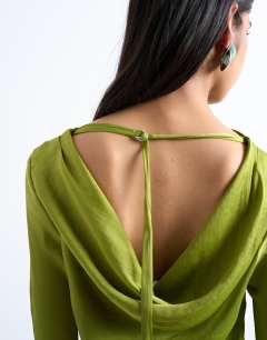 Model wearing Cowl back long sleeve mini satin in green