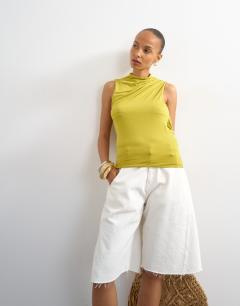 Model wearing Cowl drape back top in chartreuse
