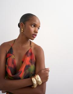 Model wearing Cowl neck dropped hem maxi dress in abstract blur