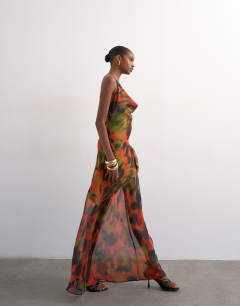 Model wearing Cowl neck dropped hem maxi dress in abstract blur
