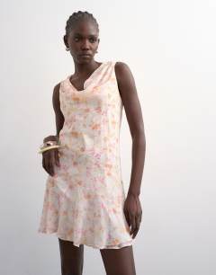 Model wearing Cowl neck full hem mini tea dress in soft pink ditsy floral