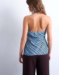 Model wearing Cowl neck halter top in blue and brown stripe