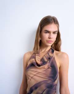 Model wearing Cowl neck halter top in woodgrain