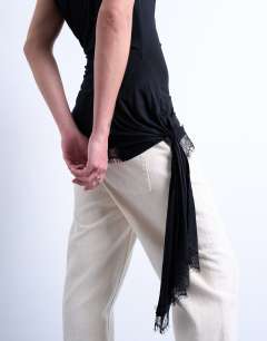 Model wearing Cowl neck lace trim top in black